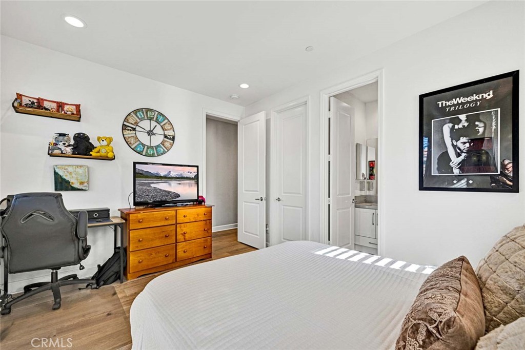 1270 Providence Loop Placentia, CA 92870 - Photo 41 of 59 a bedroom with bed and paintings on the wall