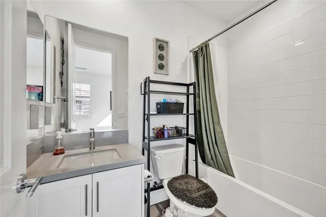 a view of a house with a yard and furniture