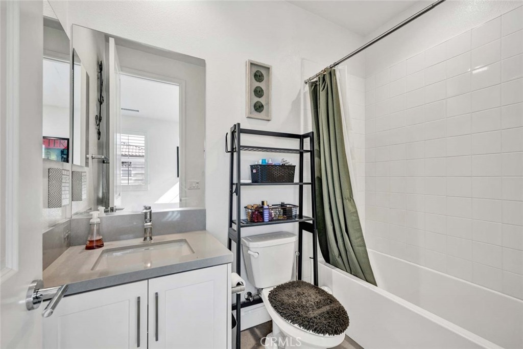 1270 Providence Loop Placentia, CA 92870 - Photo 42 of 59 a bathroom with a sink a toilet and a mirror