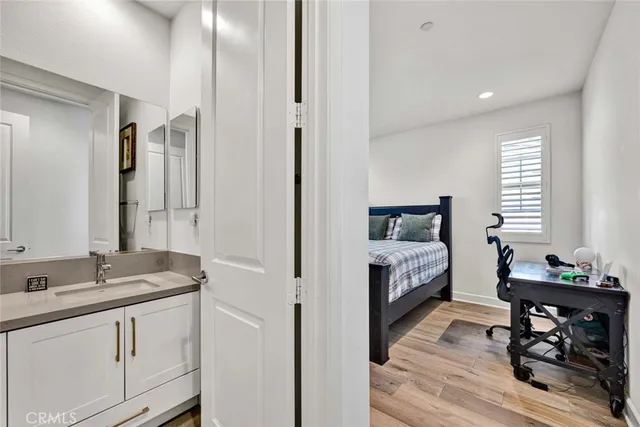 a view of a chair and table in backyard of the house