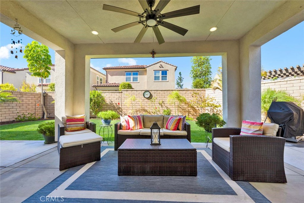 1270 Providence Loop Placentia, CA 92870 - Photo 46 of 59 Outdoor covered patio showing covered area with fan and very large lawn and yard area.