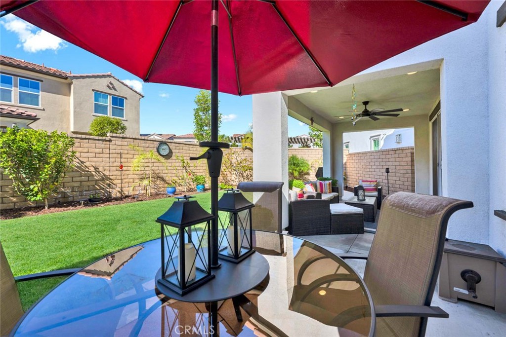 1270 Providence Loop Placentia, CA 92870 - Photo 52 of 59 a view of a patio with table and chairs under an umbrella