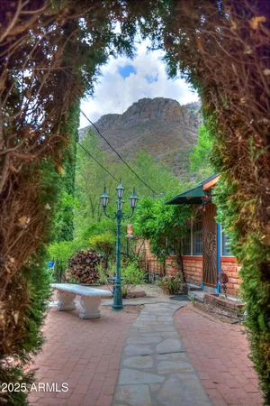 a view of a house with a yard and tree s