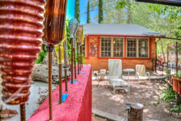 a backyard of a house with table and chairs