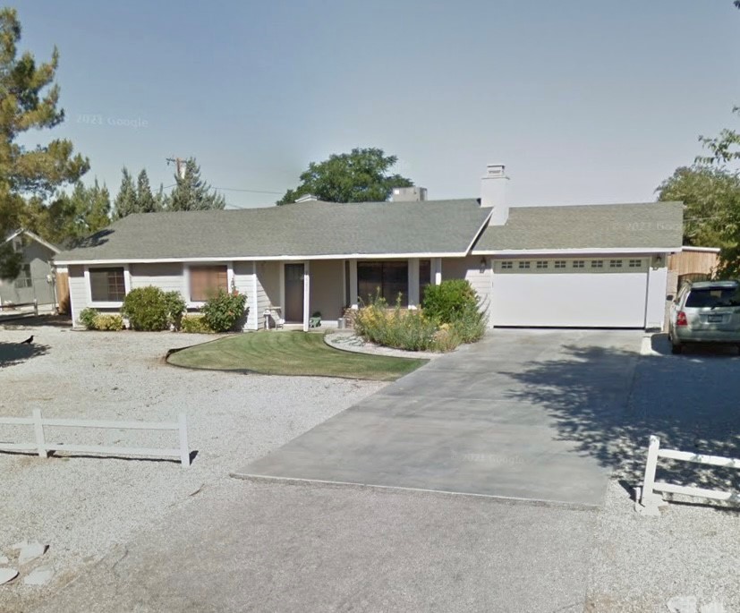 a view of house with outdoor space and street view
