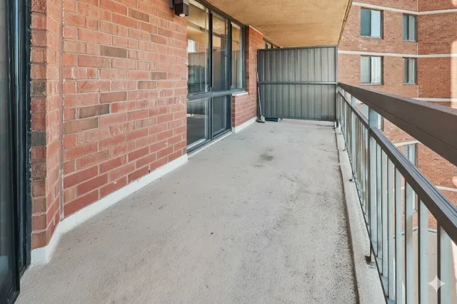 a view of balcony with wooden floor
