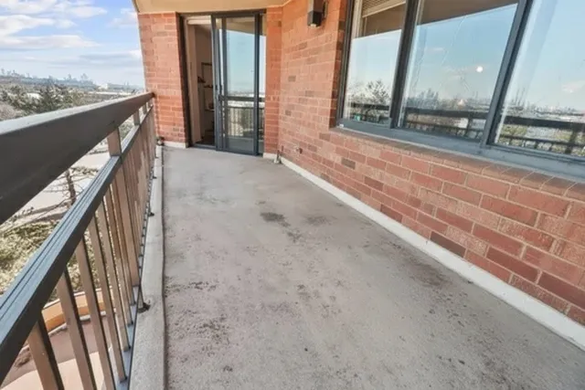 a view of balcony with a kitchen