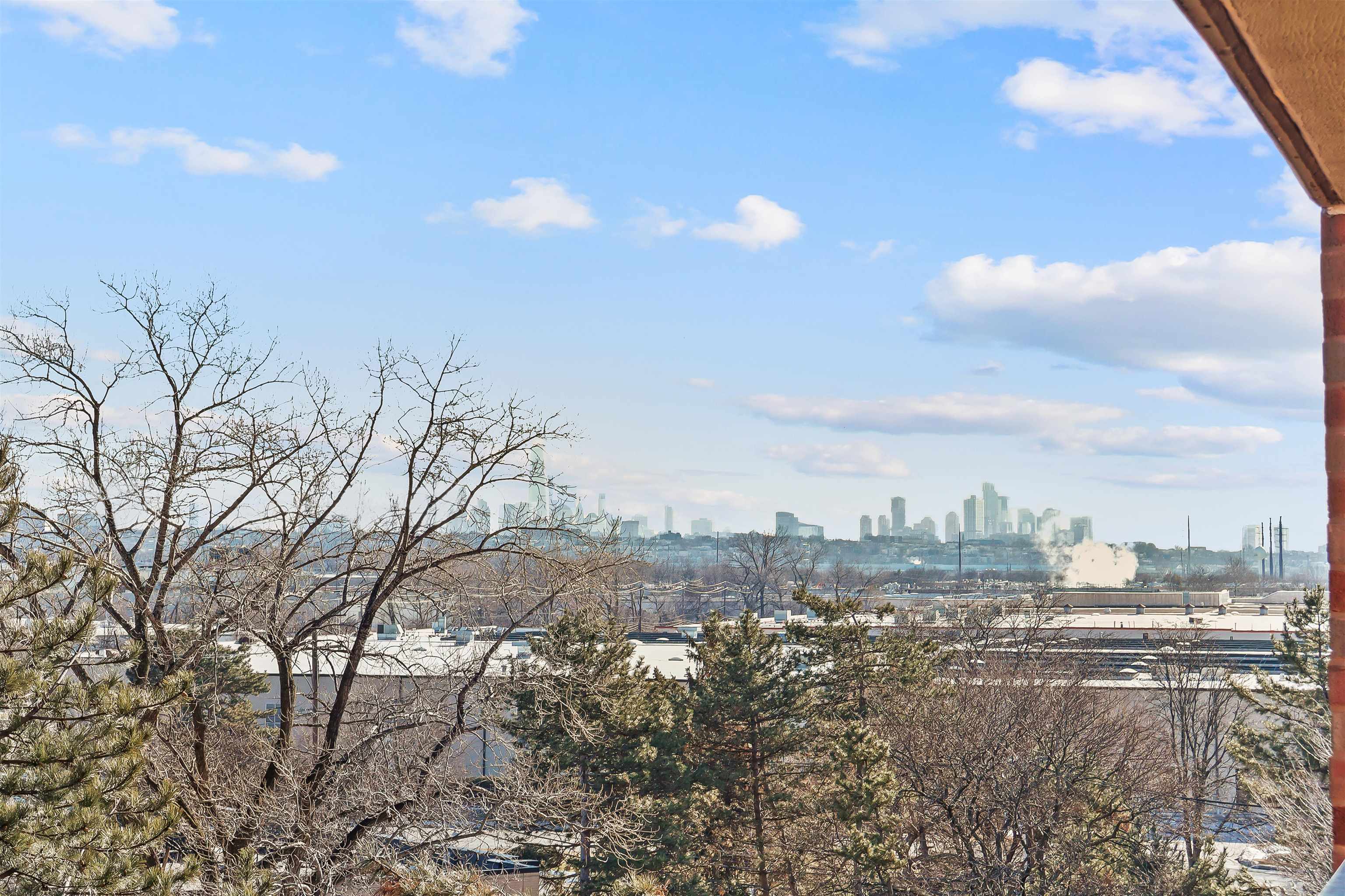 401 Harmon Cove Tower, Unit 401 Secaucus, NJ 07094 - Photo 14 of 49 a view of city and a lot of trees