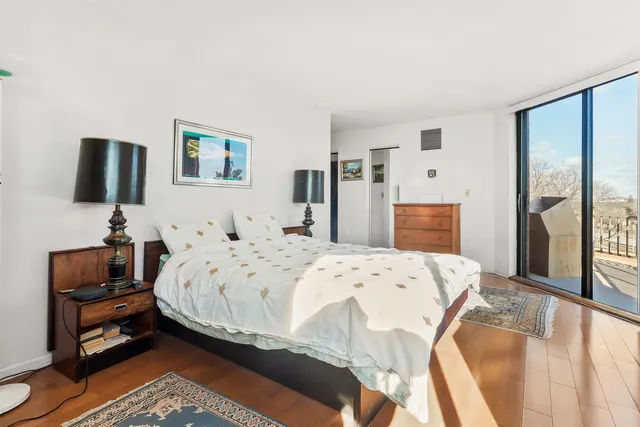 a bedroom with a bed and a couch