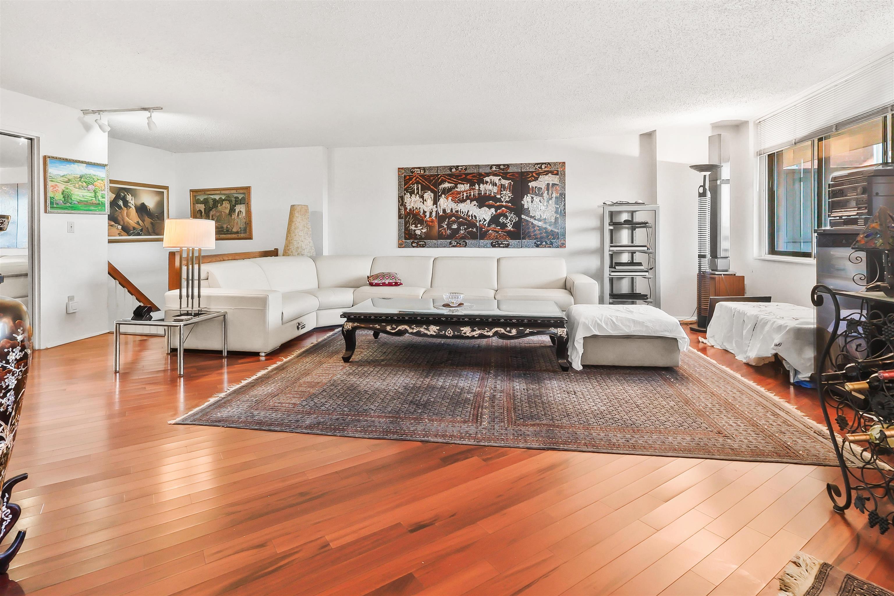 401 Harmon Cove Tower, Unit 401 Secaucus, NJ 07094 - Photo 2 of 49 a living room with furniture and a wooden floor