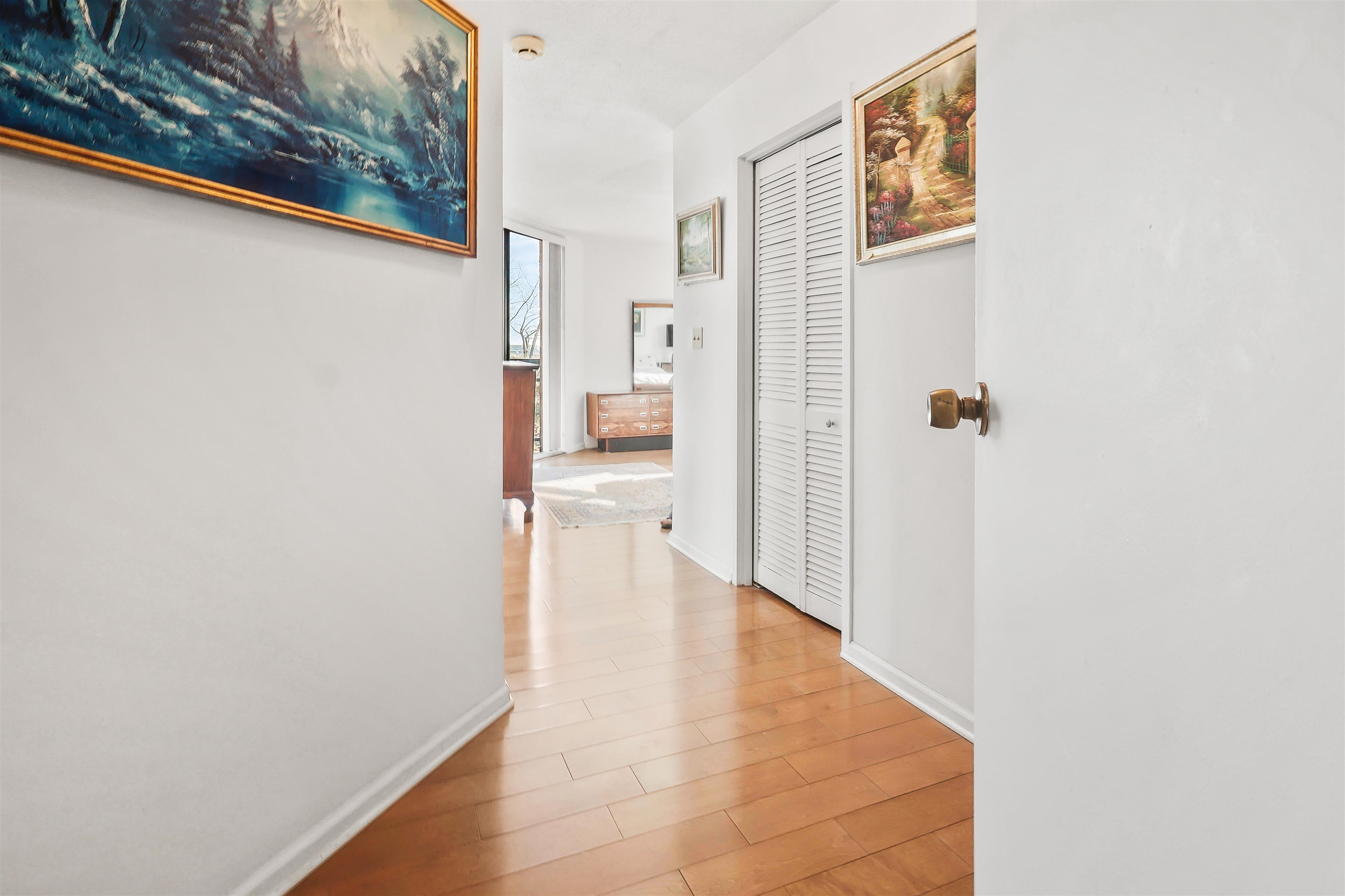 401 Harmon Cove Tower, Unit 401 Secaucus, NJ 07094 - Photo 28 of 49 a view of a hallway with wooden floor and a living room