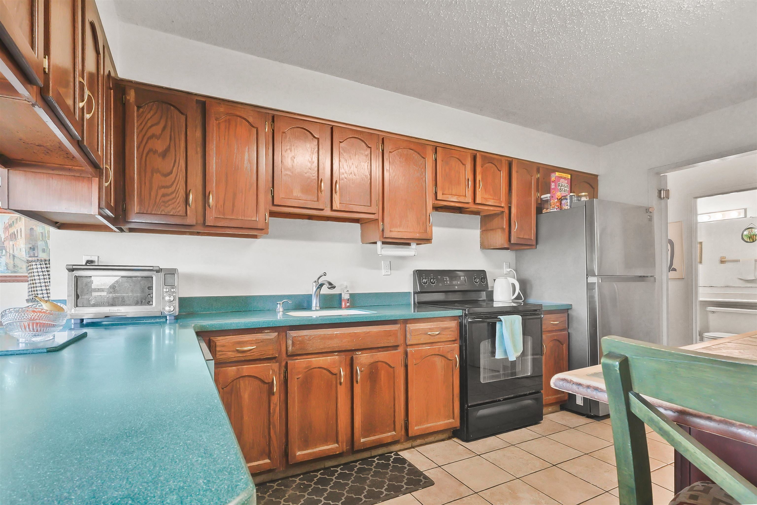 401 Harmon Cove Tower, Unit 401 Secaucus, NJ 07094 - Photo 7 of 49 a kitchen with stainless steel appliances granite countertop a sink stove and cabinets
