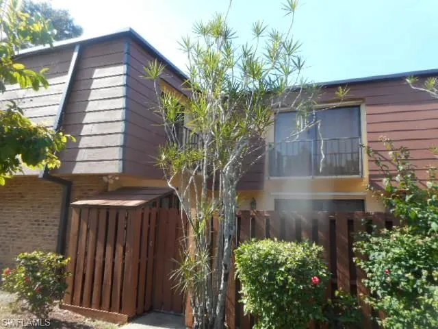 a house with a tree in front of it