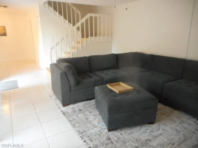 a kitchen with stainless steel appliances granite countertop a refrigerator a sink a stove and a microwave