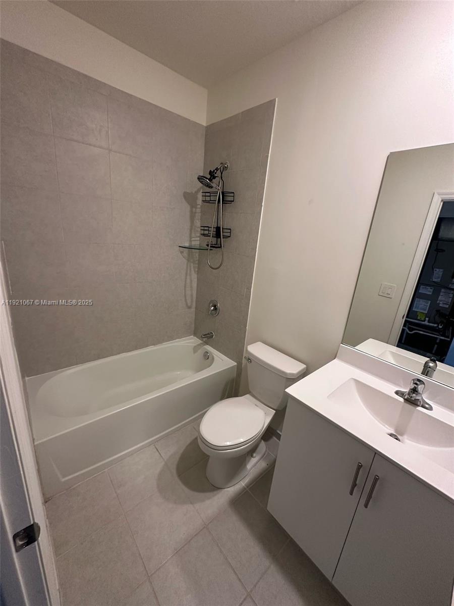 3302 West 114th Terrace Hialeah, FL 33018 - Photo 22 of 30 a bathroom with a sink a toilet and shower