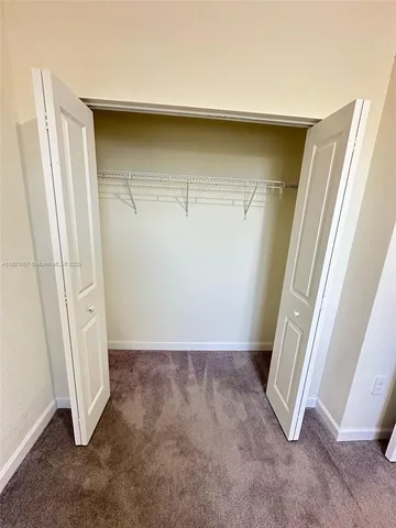 an empty room with a bench