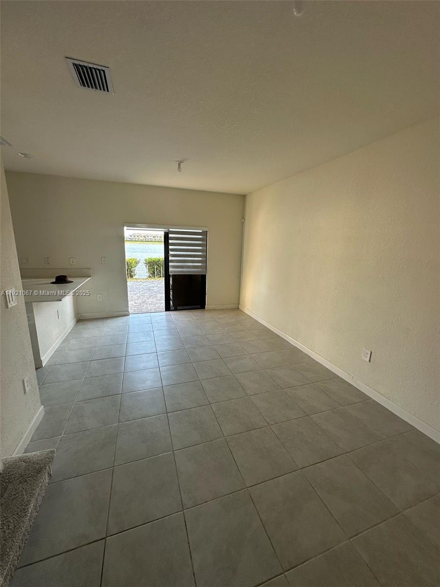 3302 West 114th Terrace Hialeah, FL 33018 - Photo 28 of 30 a view of a kitchen with an empty space and a sink