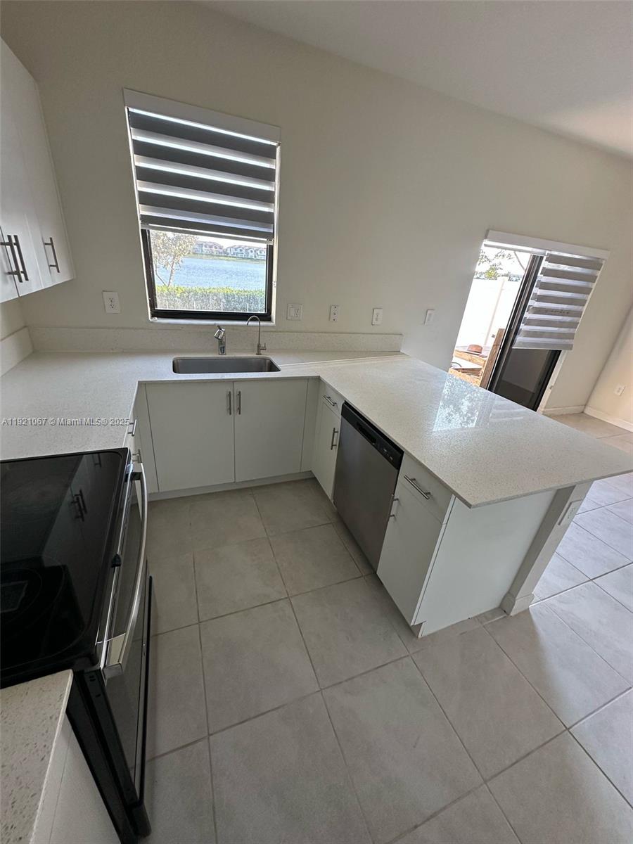 3302 West 114th Terrace Hialeah, FL 33018 - Photo 10 of 30 a view of an empty room with a window