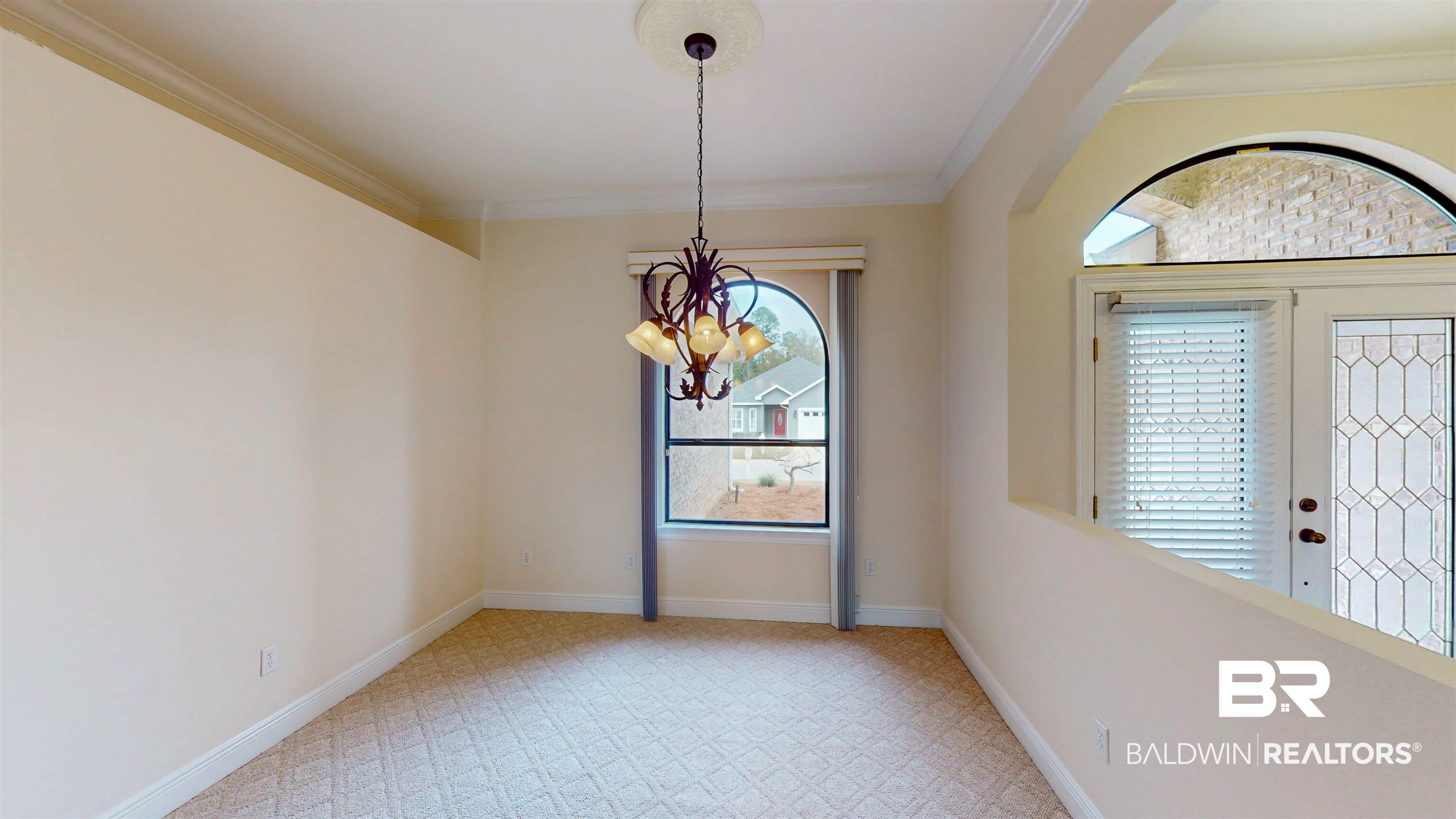 214 Hemingway Loop Foley, AL 36535 - Photo 8 of 67 Unfurnished room with a chandelier and crown molding