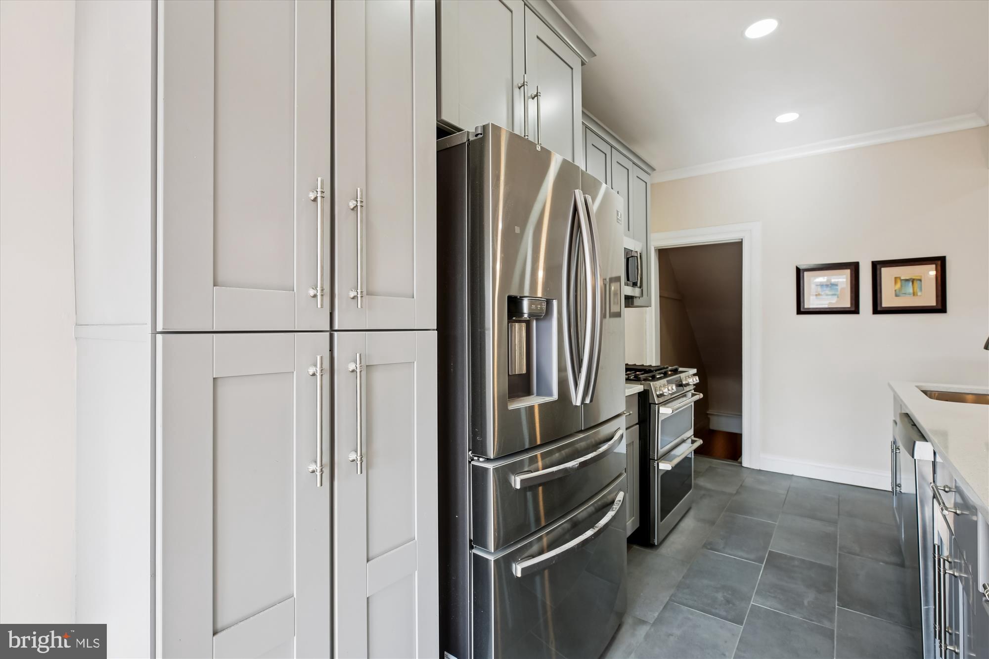 1412 Allison Street Northwest Washington, DC 20011 - Photo 14 of 62 a kitchen with stainless steel appliances a refrigerator and cabinets