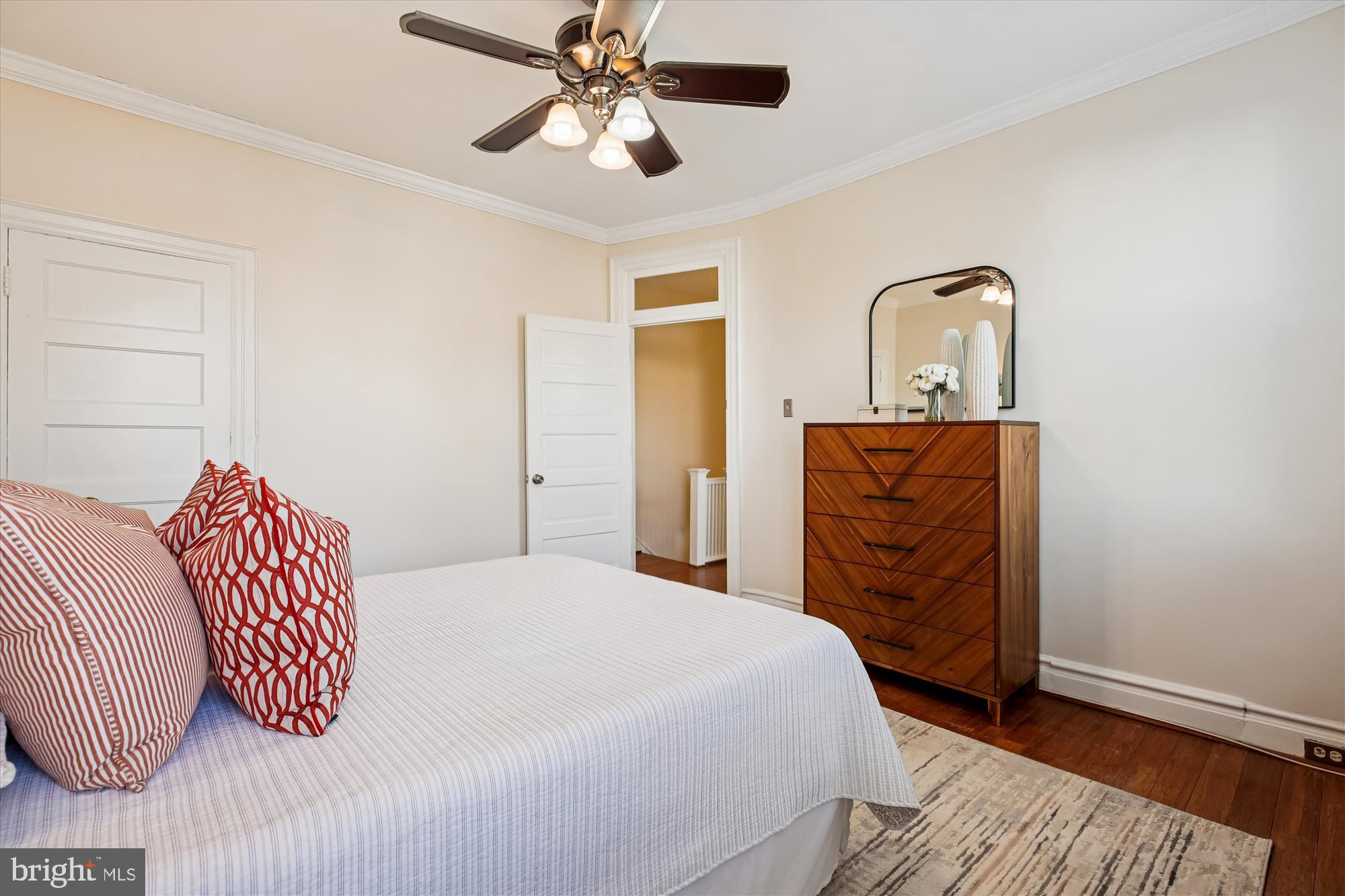 1412 Allison Street Northwest Washington, DC 20011 - Photo 24 of 62 a bedroom with a bed and a chandelier