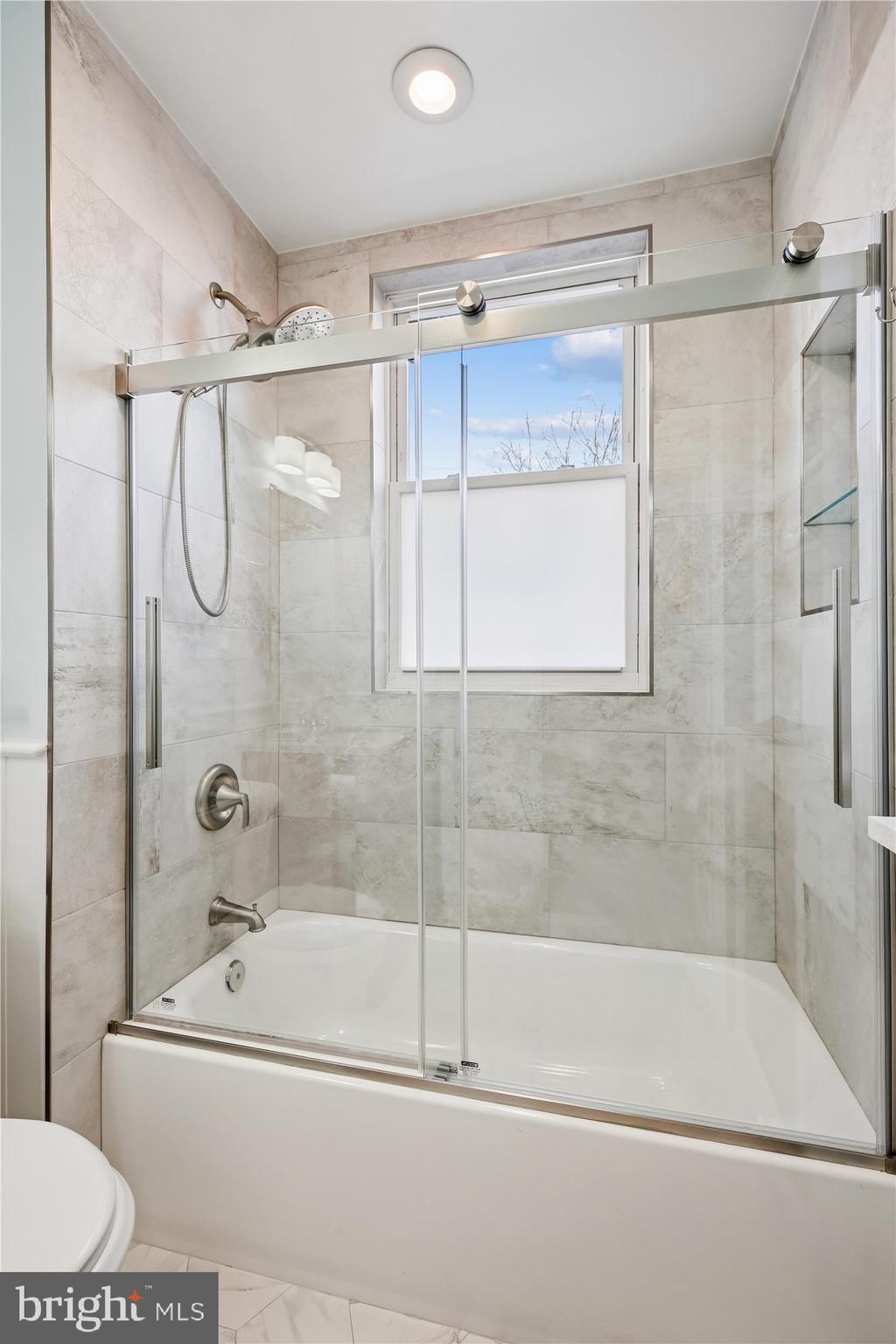 1412 Allison Street Northwest Washington, DC 20011 - Photo 25 of 62 a bathroom with a bathtub and a shower