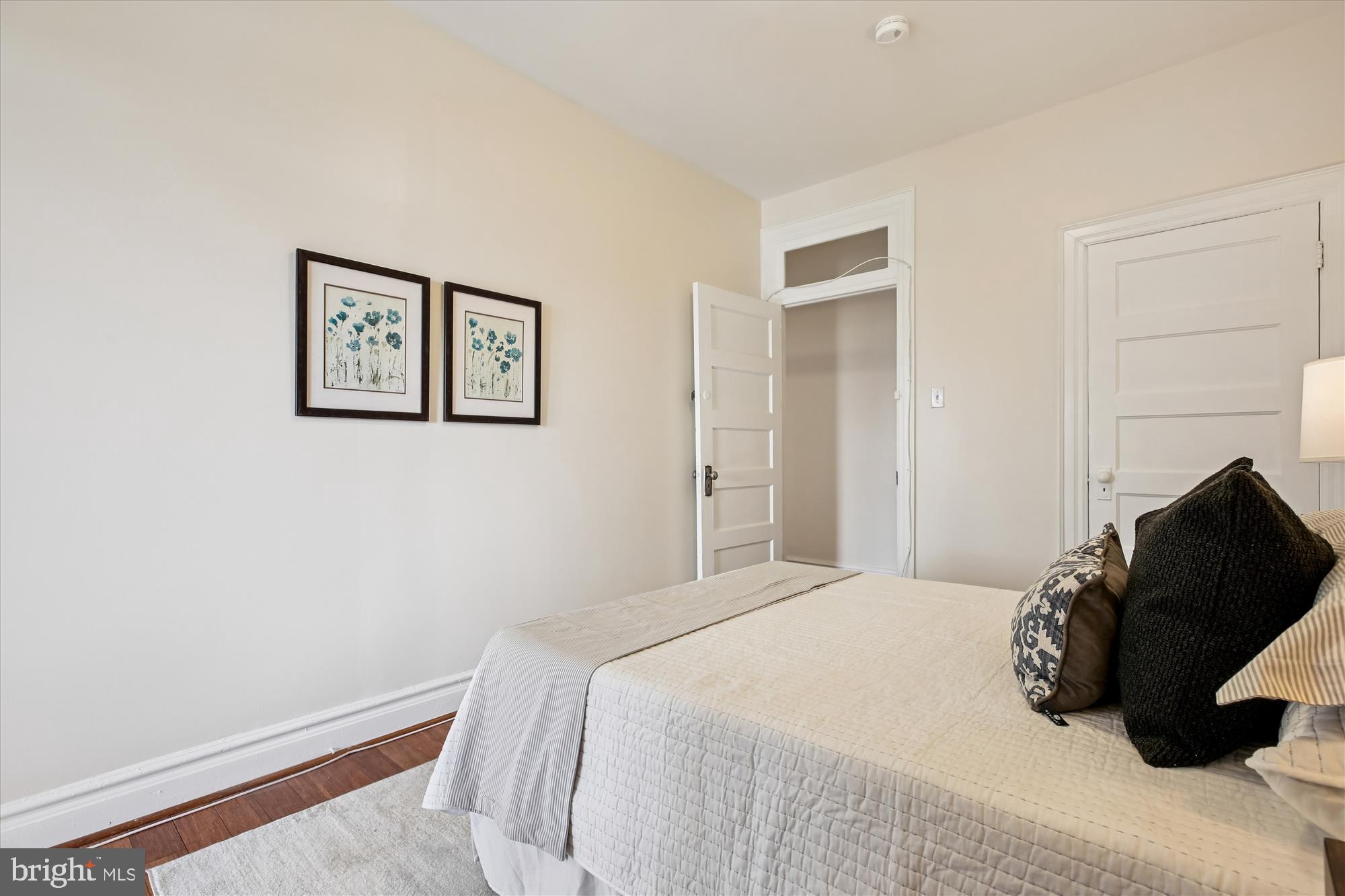 1412 Allison Street Northwest Washington, DC 20011 - Photo 28 of 62 a bedroom with a bed and painting on the wall