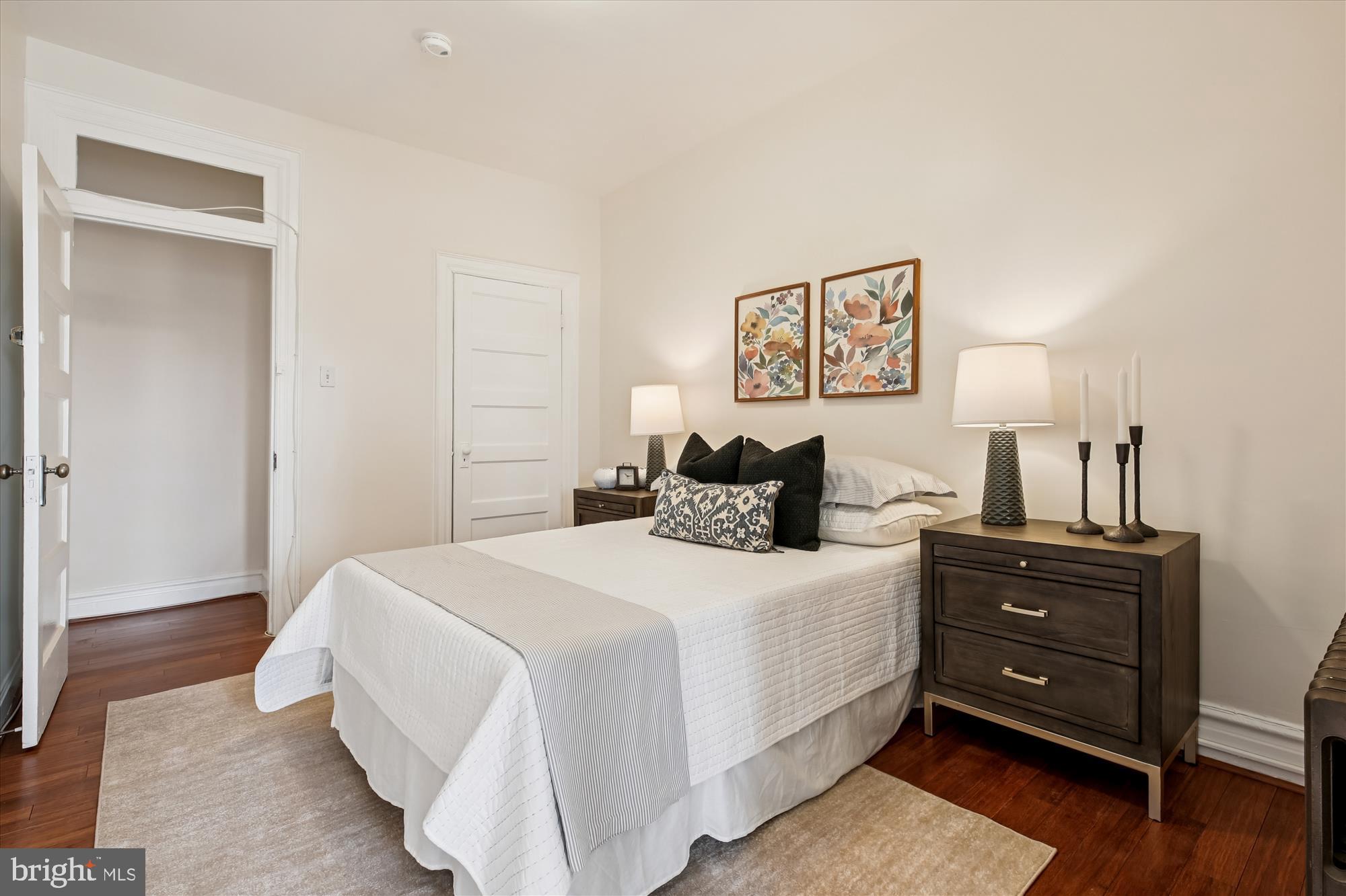 1412 Allison Street Northwest Washington, DC 20011 - Photo 29 of 62 a bedroom with a bed and wooden floor