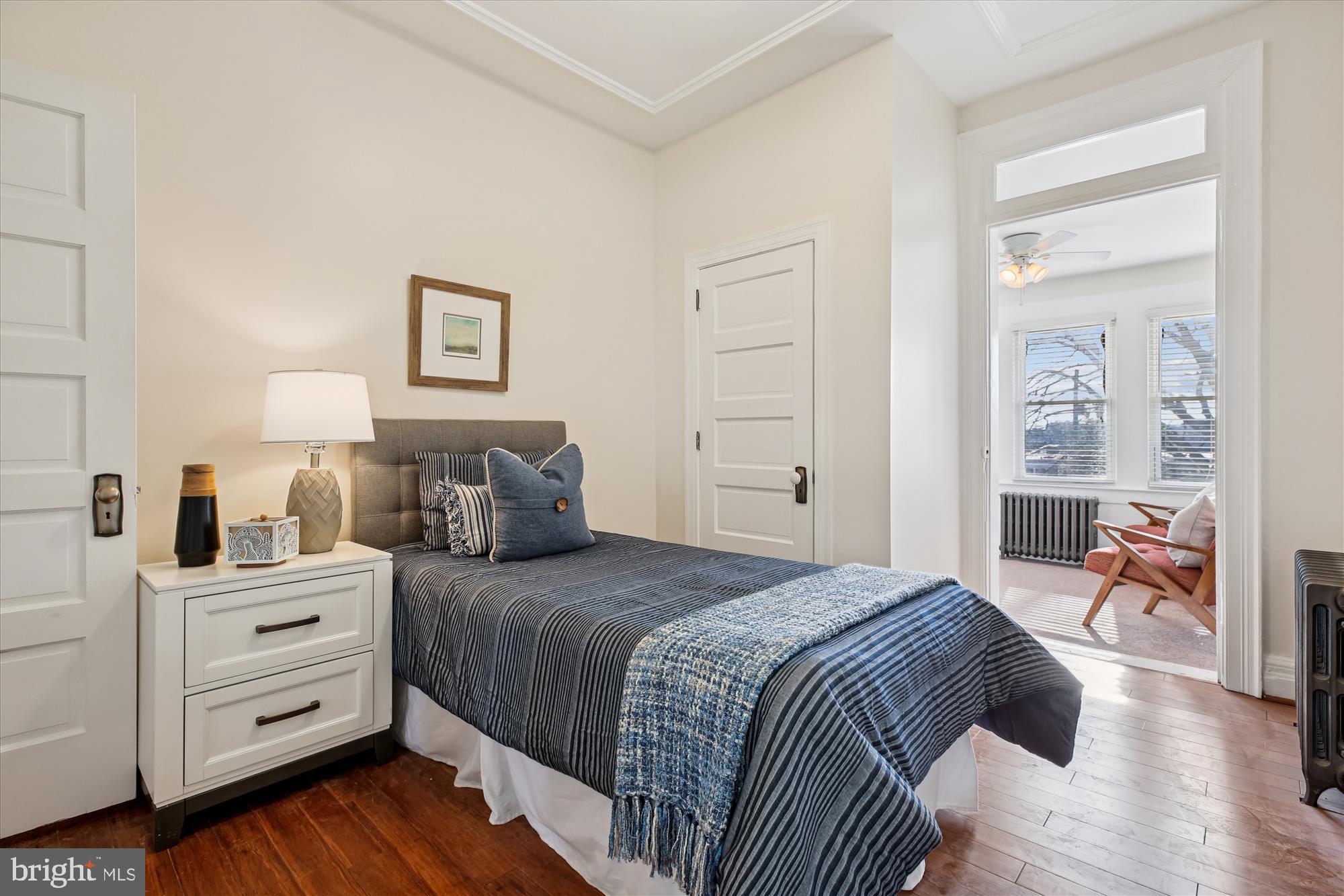 1412 Allison Street Northwest Washington, DC 20011 - Photo 35 of 62 a bedroom with a bed and wooden floor