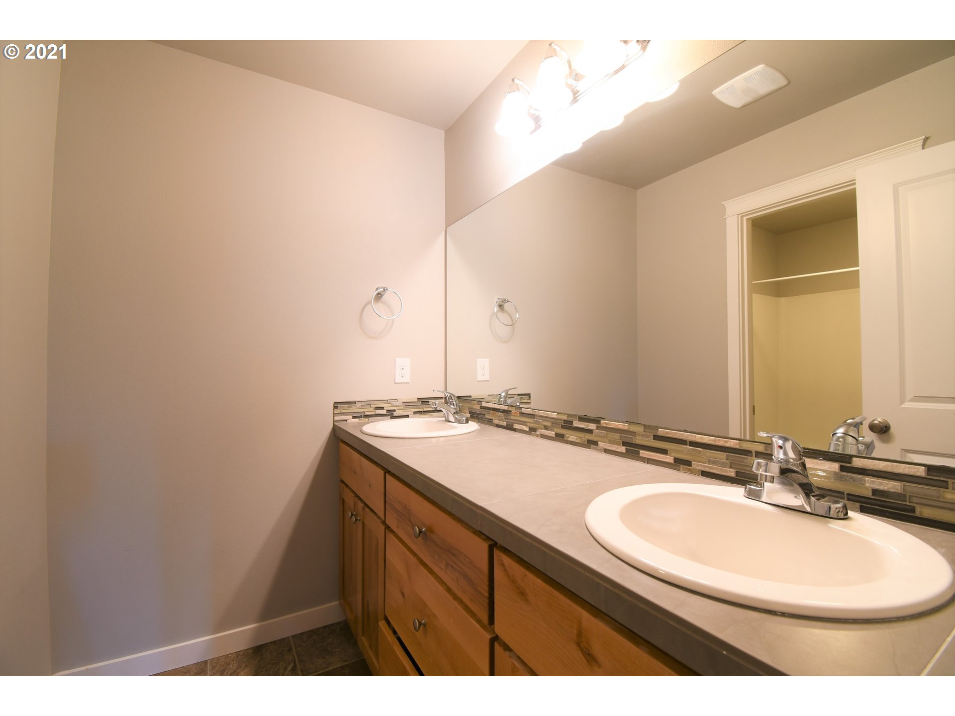 4361 North 2nd Way Ridgefield, WA 98642 - Photo 16 of 19 a bathroom with a sink and a mirror