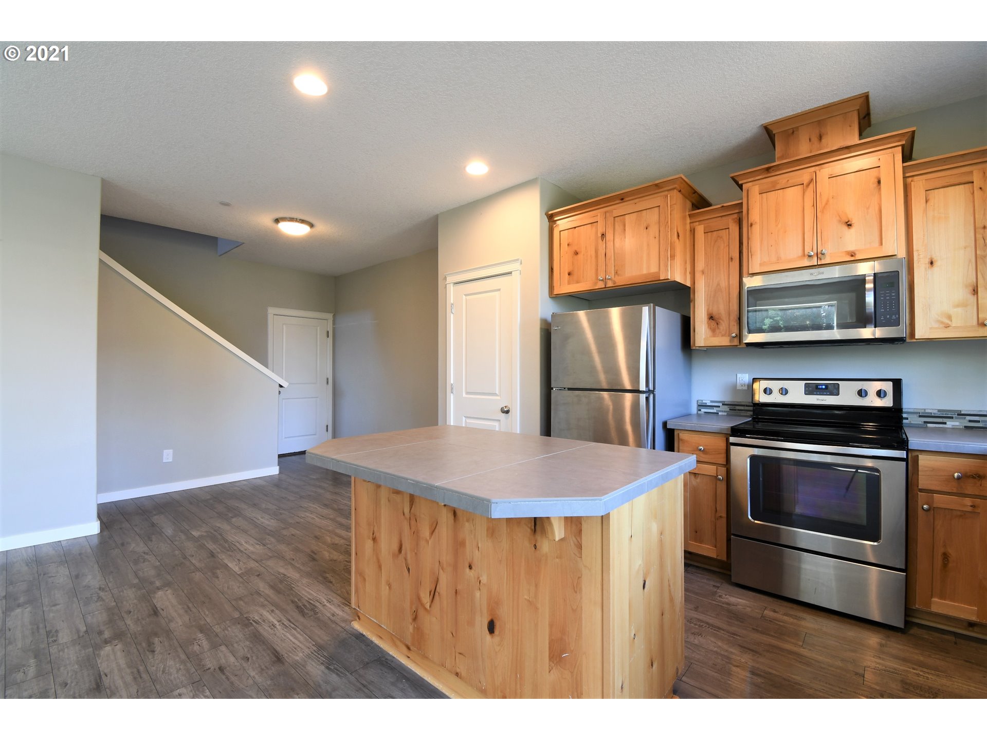 4361 North 2nd Way Ridgefield, WA 98642 - Photo 4 of 19 a kitchen with stainless steel appliances granite countertop a sink a stove and a refrigerator