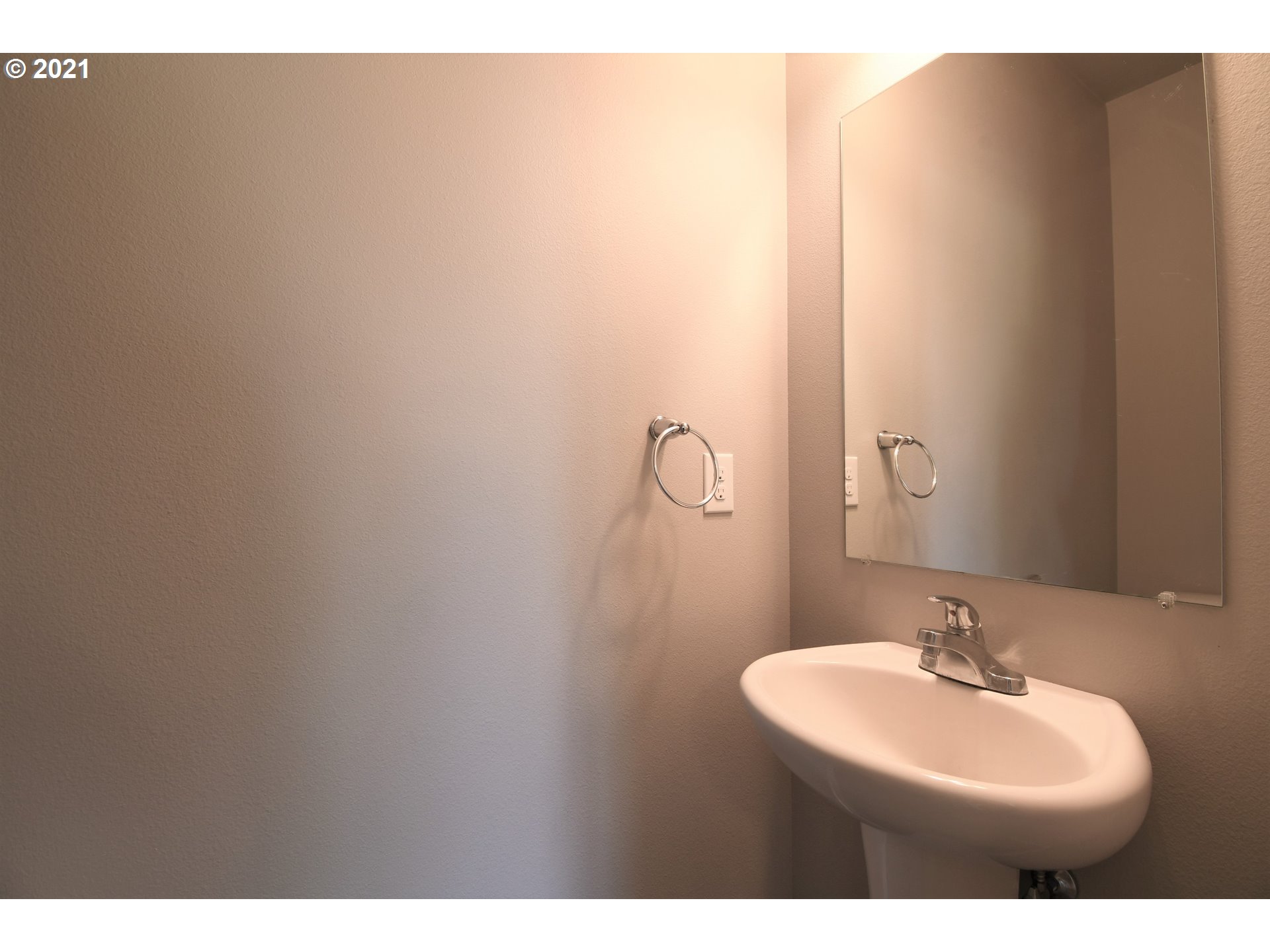 4361 North 2nd Way Ridgefield, WA 98642 - Photo 7 of 19 a bathroom with a sink and a mirror