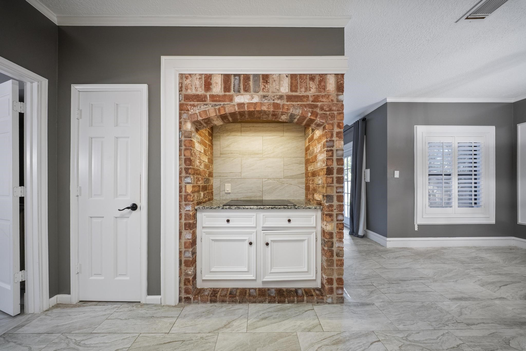 11626 Taos Lane Houston, TX 77070 - Photo 18 of 32 a view of an entryway with a fireplace
