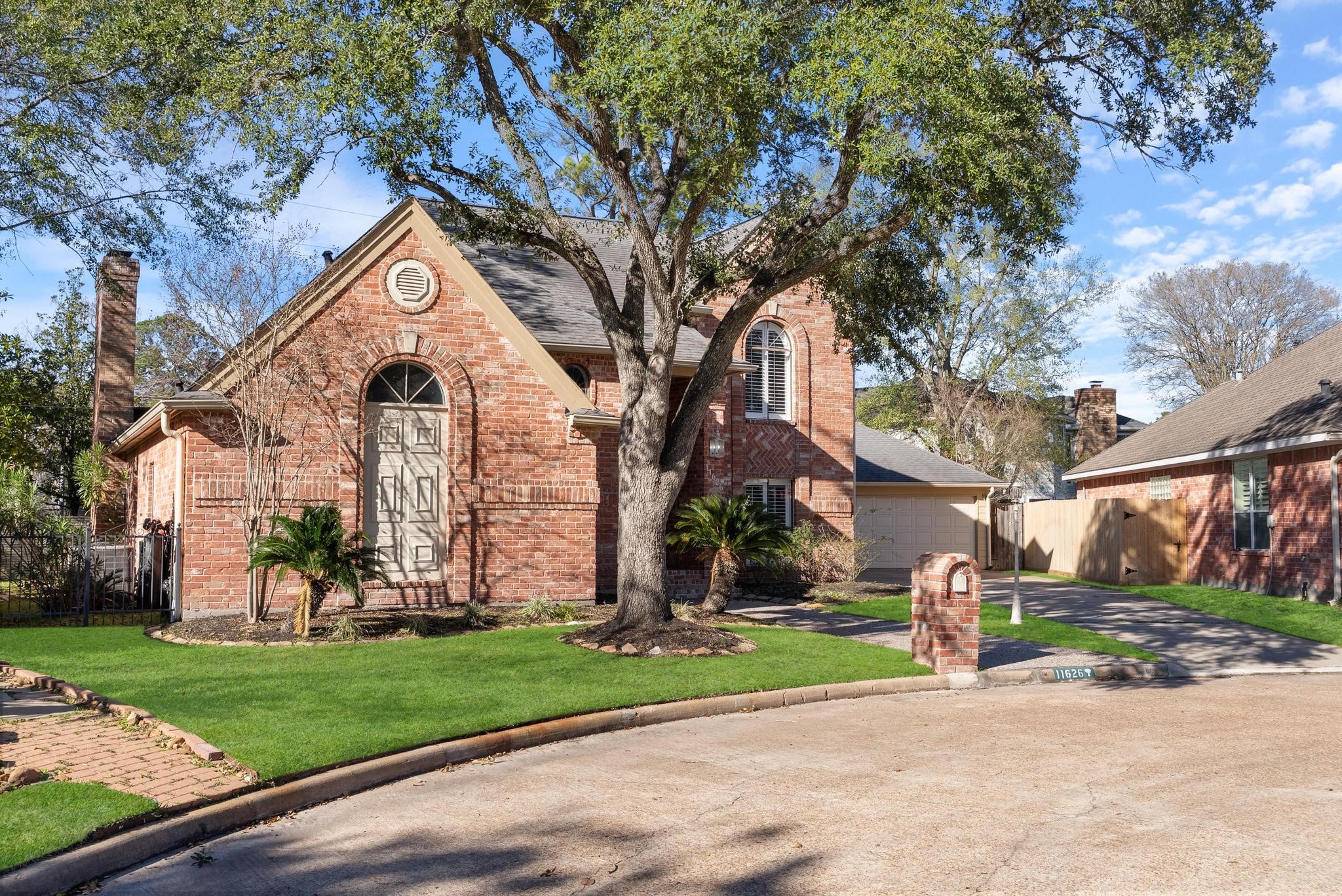 11626 Taos Lane Houston, TX 77070 - Photo 2 of 32 a front view of a house with garden