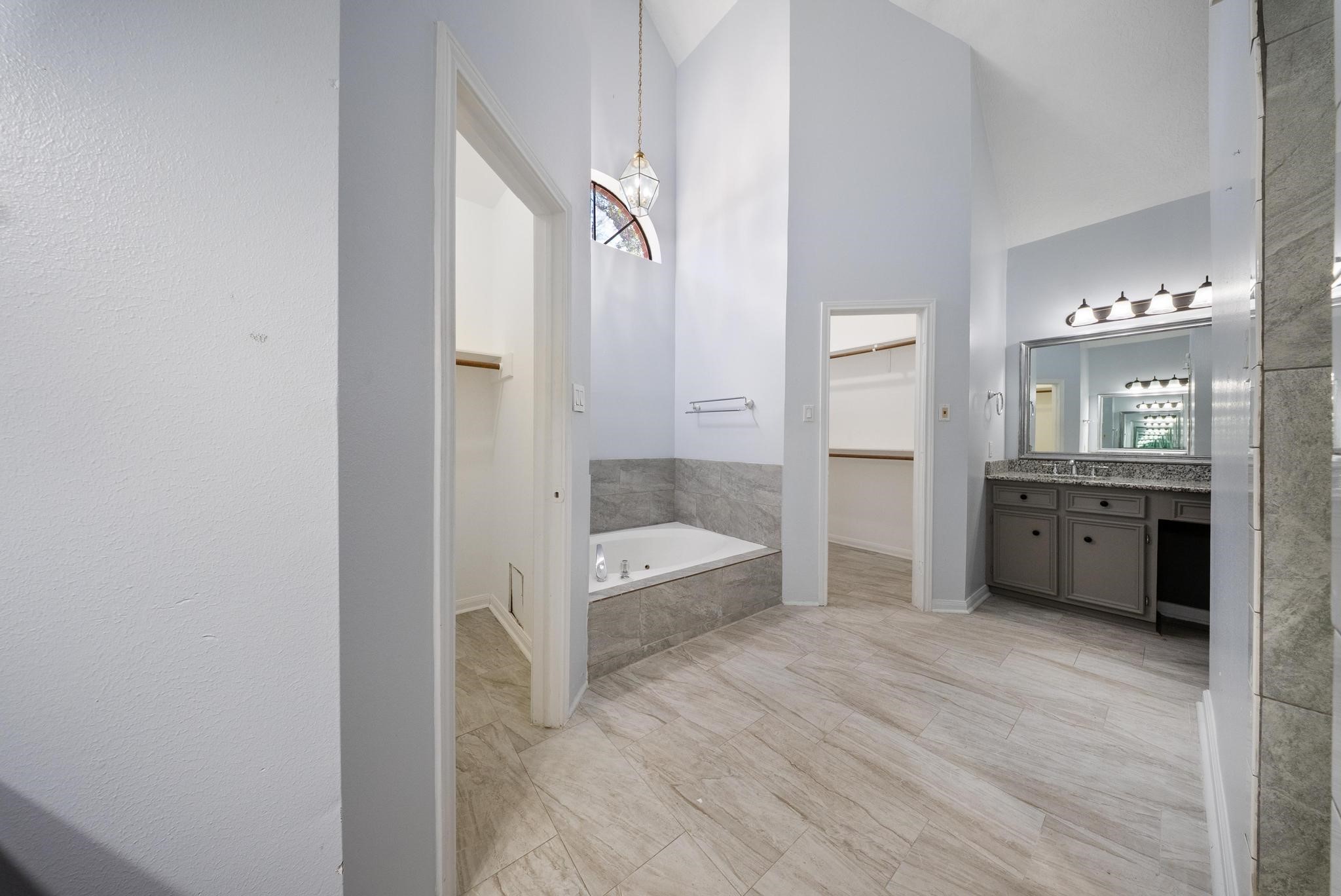 11626 Taos Lane Houston, TX 77070 - Photo 21 of 32 a bathroom with a double vanity sink a toilet a shower and a mirror