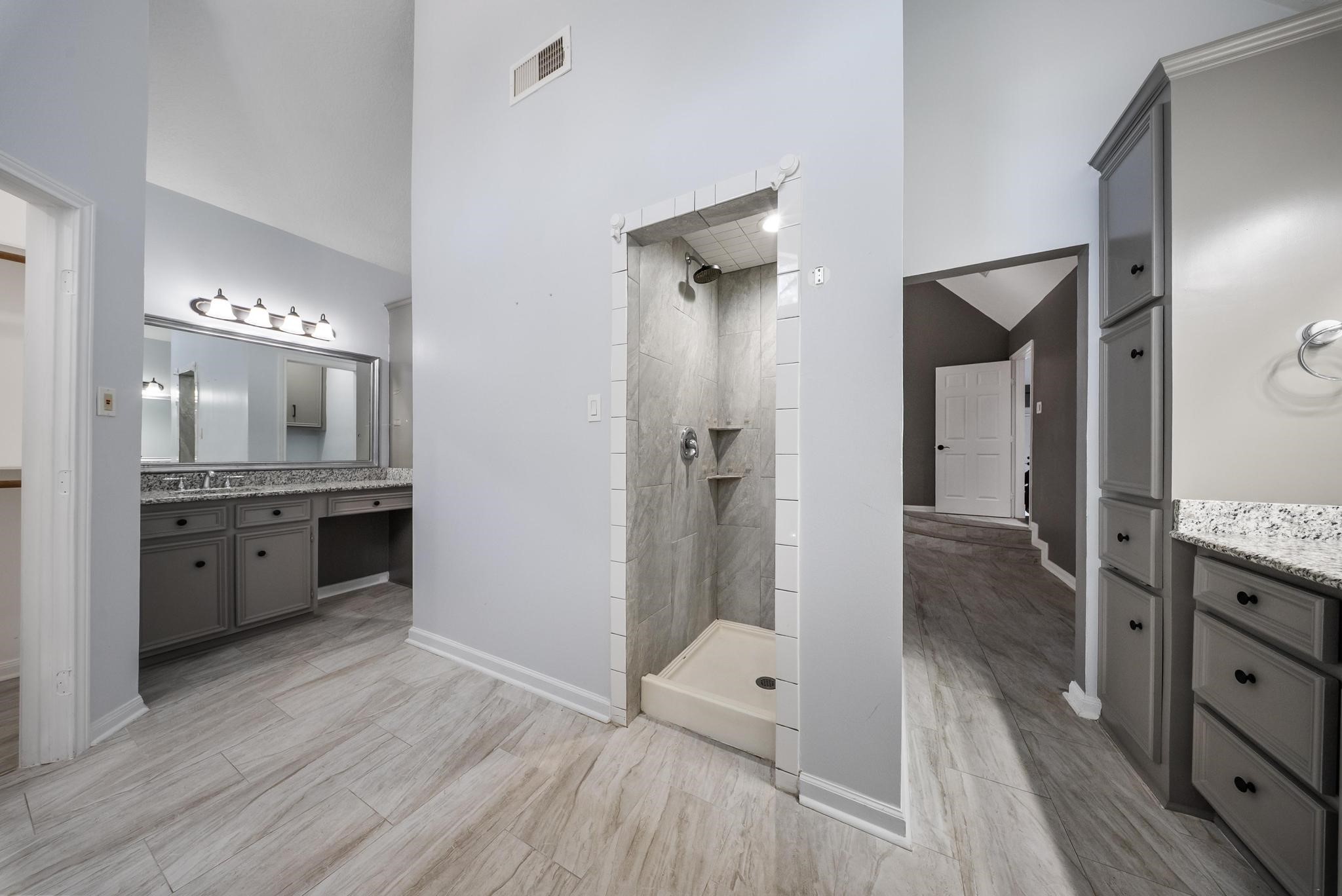 11626 Taos Lane Houston, TX 77070 - Photo 23 of 32 a bathroom with a double vanity sink a toilet and shower