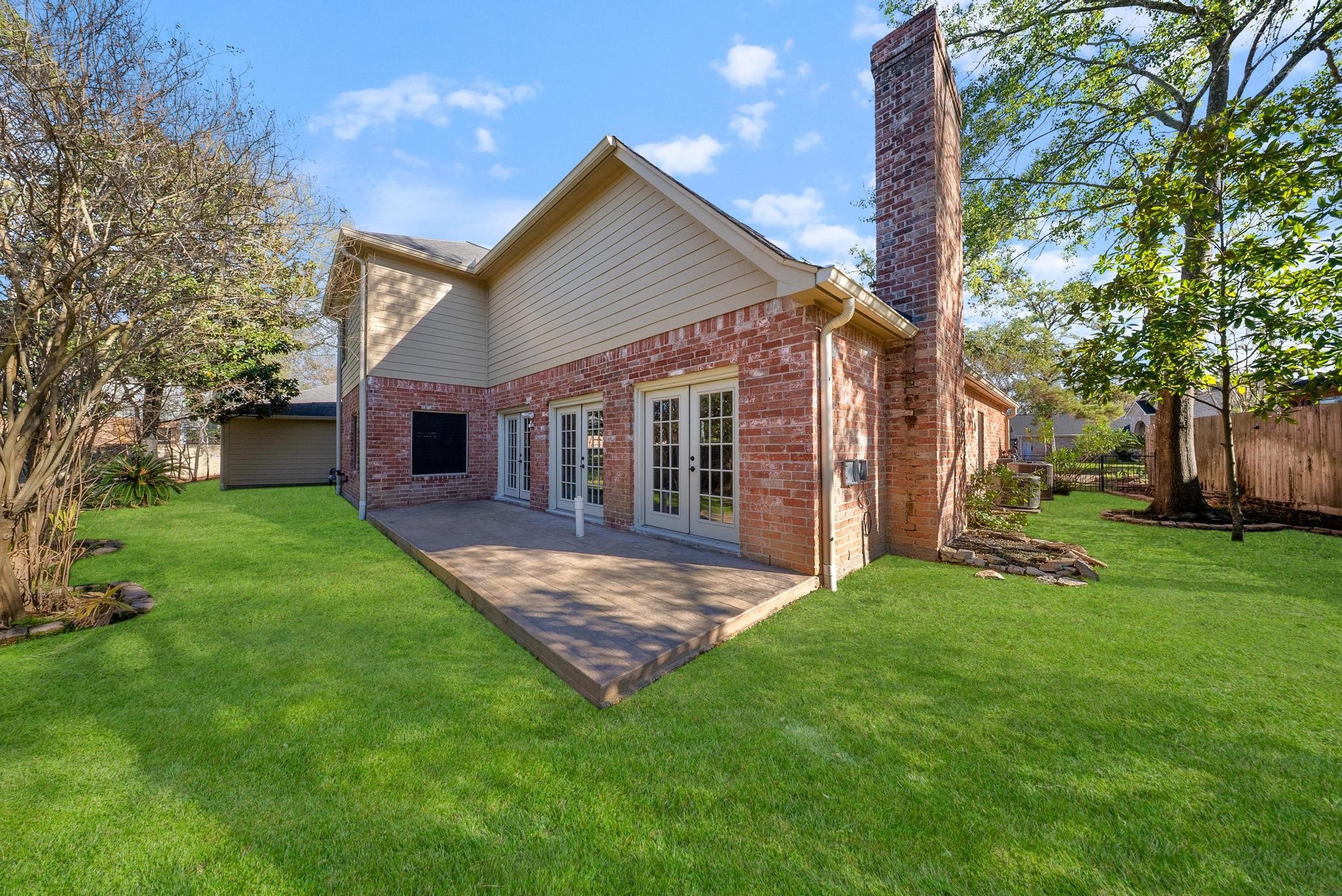 11626 Taos Lane Houston, TX 77070 - Photo 30 of 32 a view of a house with a big yard and large tree