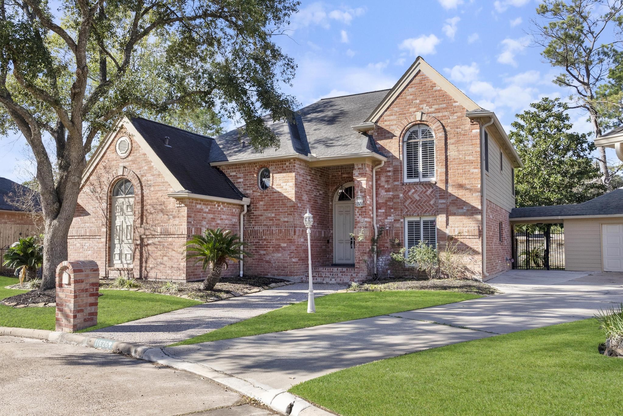 11626 Taos Lane Houston, TX 77070 - Photo 3 of 32 a front view of a house with a yard