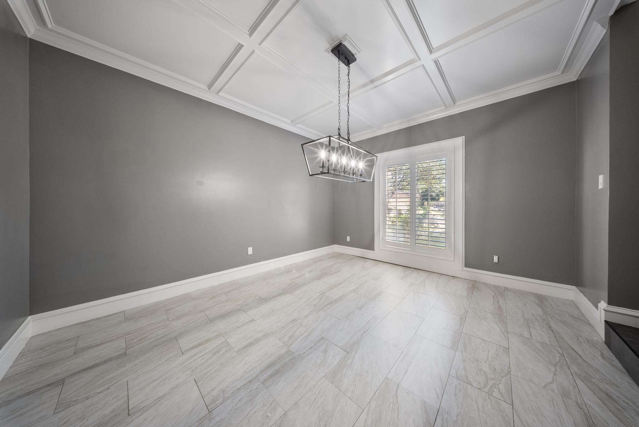 11626 Taos Lane Houston, TX 77070 - Photo 9 of 32 a view of an empty room with wooden floor and a window