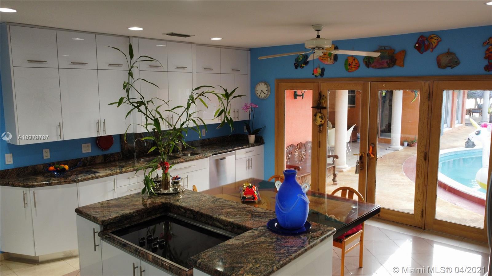 Key Biscayne Key Biscayne, FL 33149 - Photo 8 of 20 a kitchen with granite countertop a sink stove and cabinets