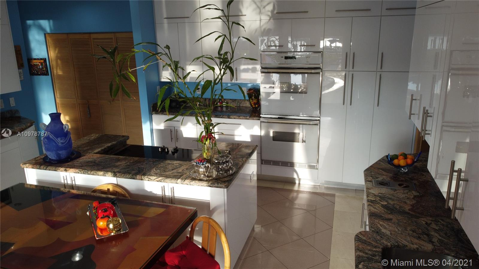 Key Biscayne Key Biscayne, FL 33149 - Photo 9 of 20 a kitchen with stainless steel appliances kitchen island granite countertop a refrigerator and a stove