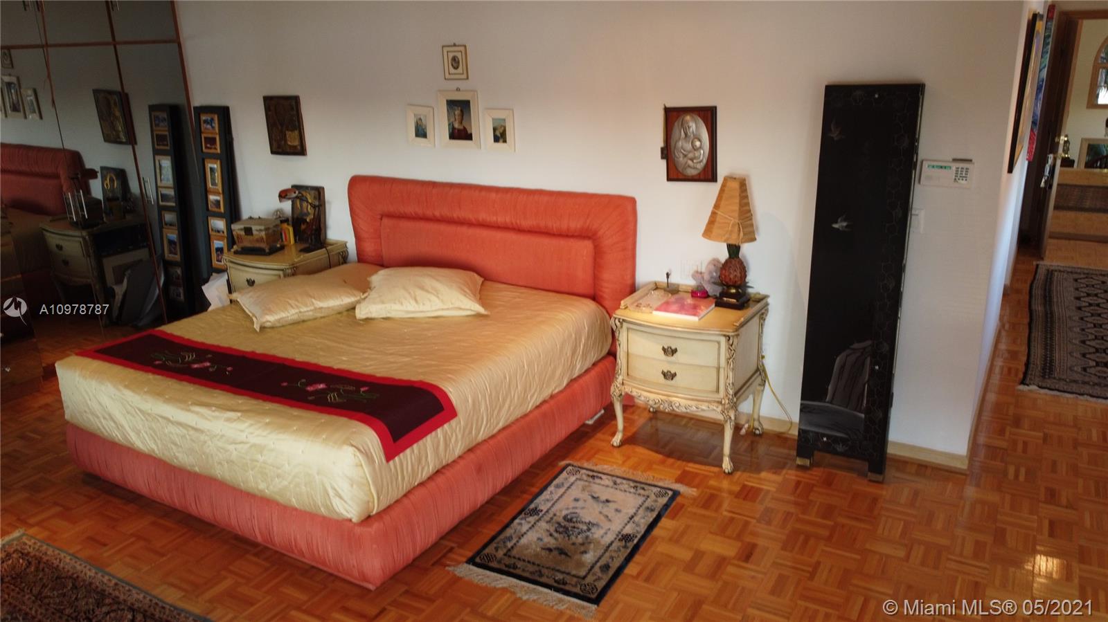 Key Biscayne Key Biscayne, FL 33149 - Photo 10 of 20 a bedroom with a bed and wooden floor