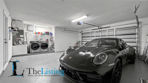 a living room with furniture and a ceiling fan