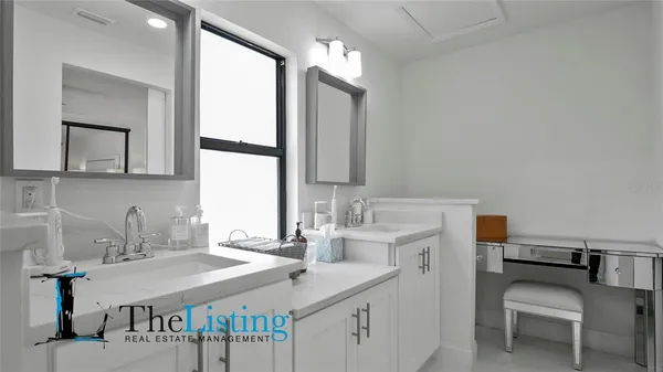 a bedroom with a bed and a table