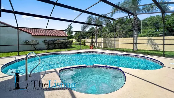 a view of a backyard with swimming pool