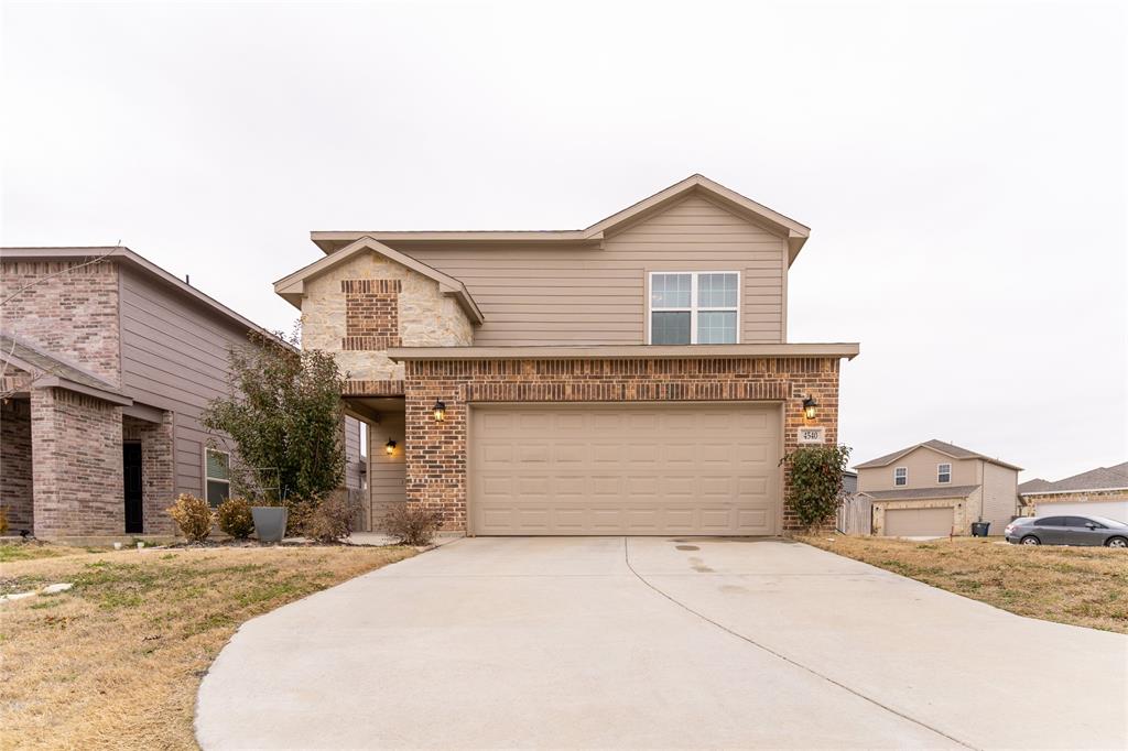 4540 Raleigh Dalton Road Dallas, TX 75227 - Photo 1 of 1 a front view of a house with a yard and garage