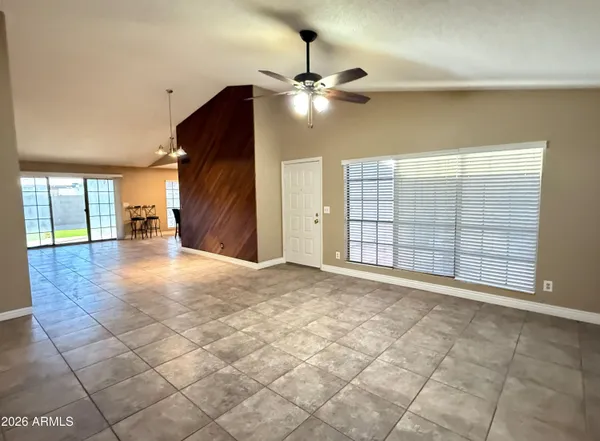 a view of an empty room with glass door