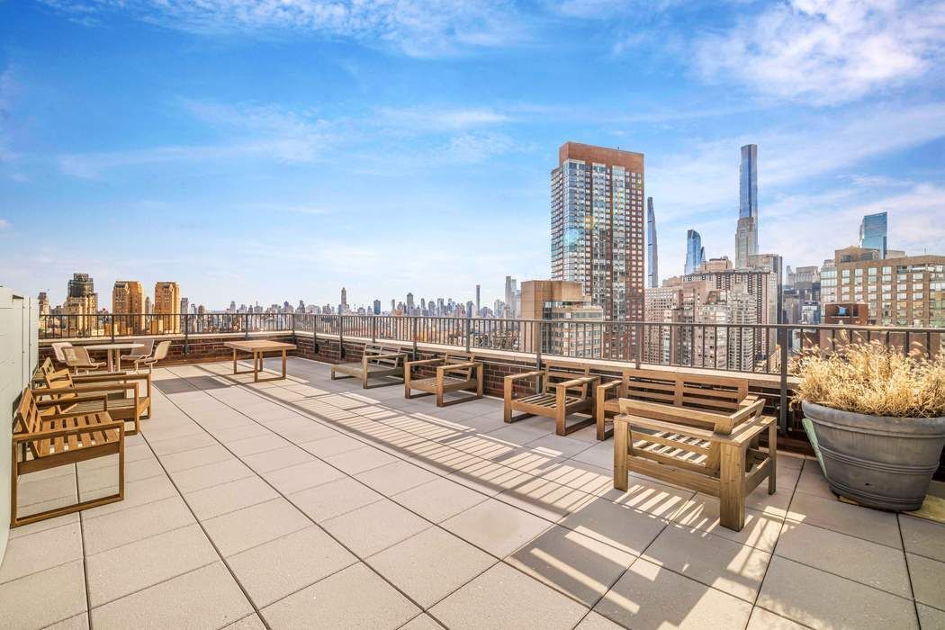2025 Broadway, Unit 18D Manhattan, NY 10023 - Photo 7 of 12 a view of roof with city view