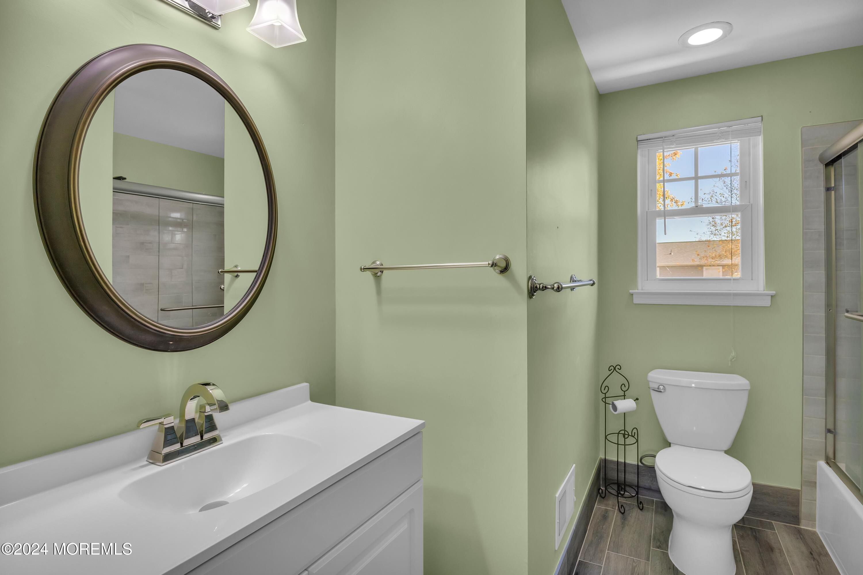 17 Willow Ridge Road Marlton, NJ 08053 - Photo 24 of 36 a bathroom with a sink a toilet and a mirror