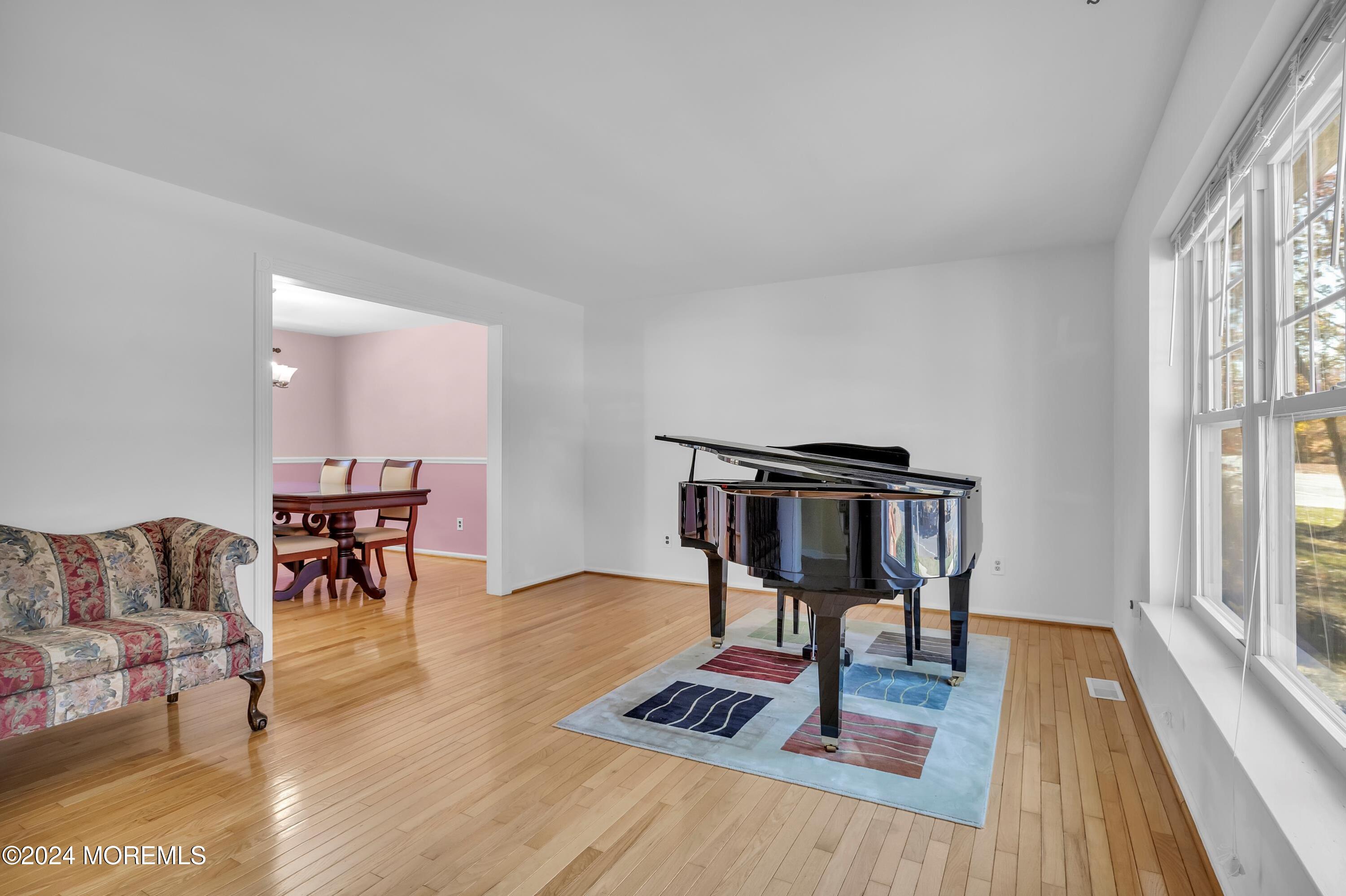 17 Willow Ridge Road Marlton, NJ 08053 - Photo 6 of 36 a living room with furniture and a wooden floor